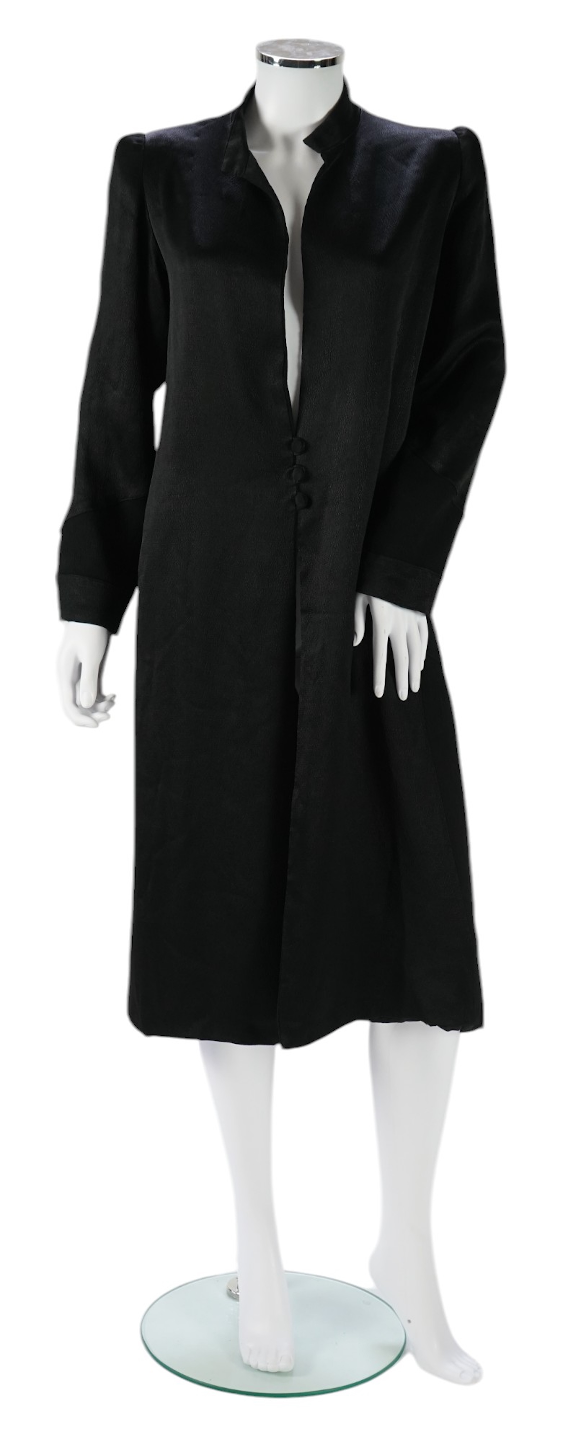 A 1930's black satin evening coat, with small collar and covered buttons to the front. Decorated with chevron motifs at side and lower sleeve detailing, front under arm width 19 inches, length back: top of collar to bott